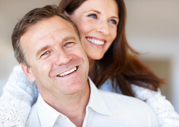 Confident smile after dental implant treatment in Guildford